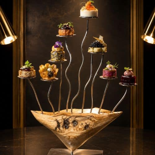 Sculpture en olivier avec neuf supports en rond en inox pour poser des mignardises ou autre